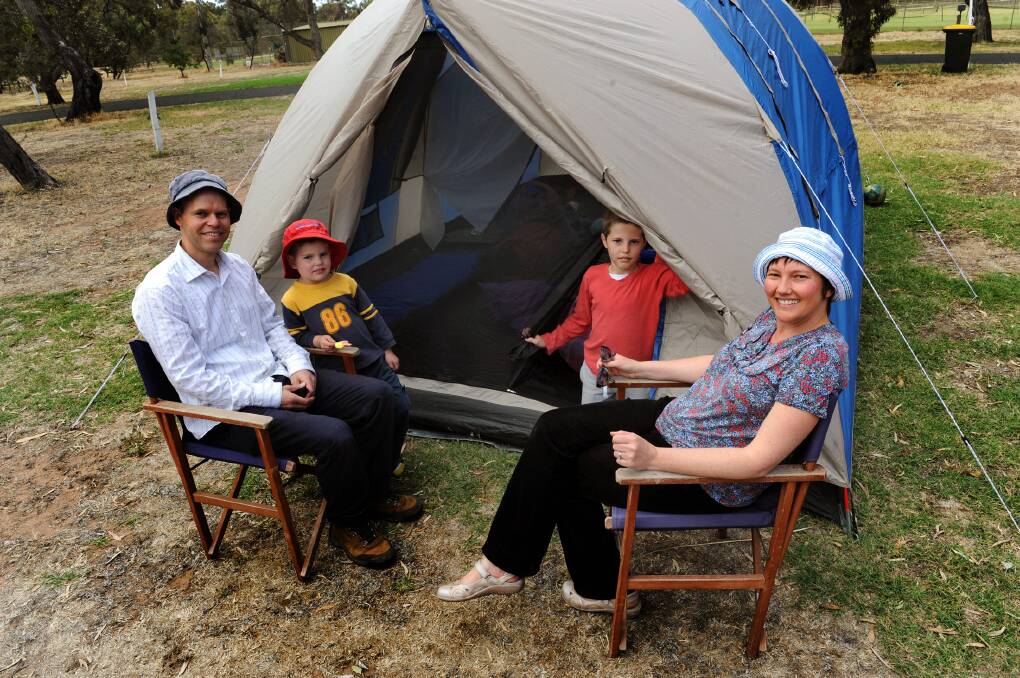 Adelaide couple Emma and Chris McMurray, with boys Eric, 8, and Thomas, 4, relax at Horsham Caravan Park earlier this year. Picture: PAUL CARRACHER