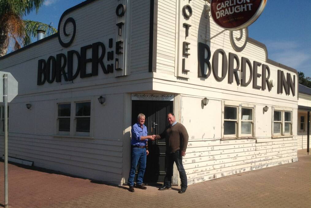 TO OPEN: Investor Noel Ogilvie welcomes the Border Inn’s new manager Andrew Martin. Picture: CONTRIBUTED