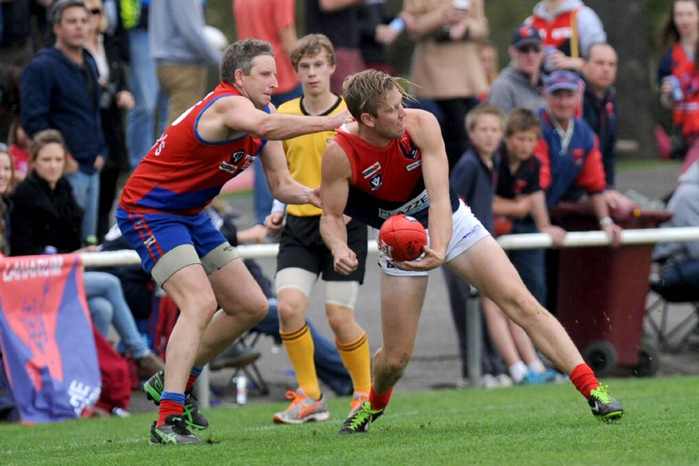 Laharum defender Alex Ellifson, pictured against Kalkee's Adam Carter in last year's grand final, was among the best in the team's smashing of Pimpinio on Saturday. Picture: SAMANTHA CAMARRI