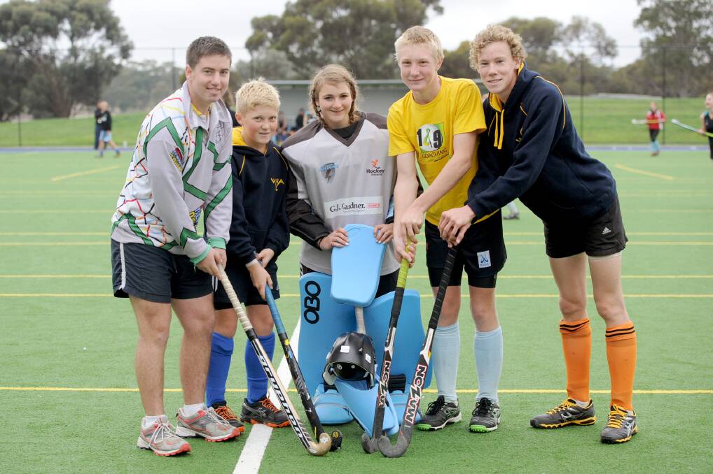 STICKING AT IT: Warracknabeal assistant coach Marcus Williamson and junior hockey players Luke Shalders of Kaniva, Brittany Keam of Yanac, Duncan Shalders of Kaniva and William Gulline of Horsham have been selected to represent the North-West Lightning region at next month’s GJ Gardner Homes Junior State Championships in Melbourne. Picture: PAUL CARRACHER