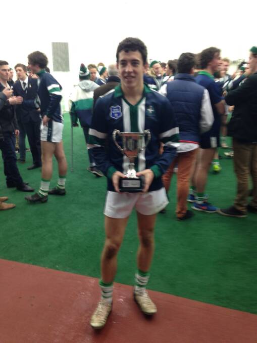 VICTORIOUS: Jacob O’Beirne with the Herald Sun cup.