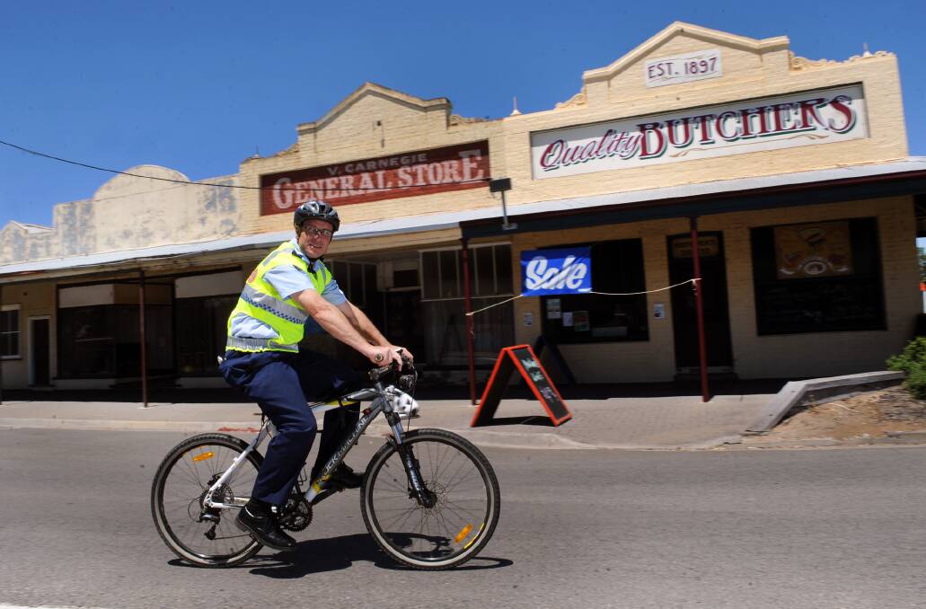 Minyip Senior Constable David Flannery on bike patrol in Minyip. Horsham is also looking to revive its bicycle patrol. Picture: PAUL CARRACHER