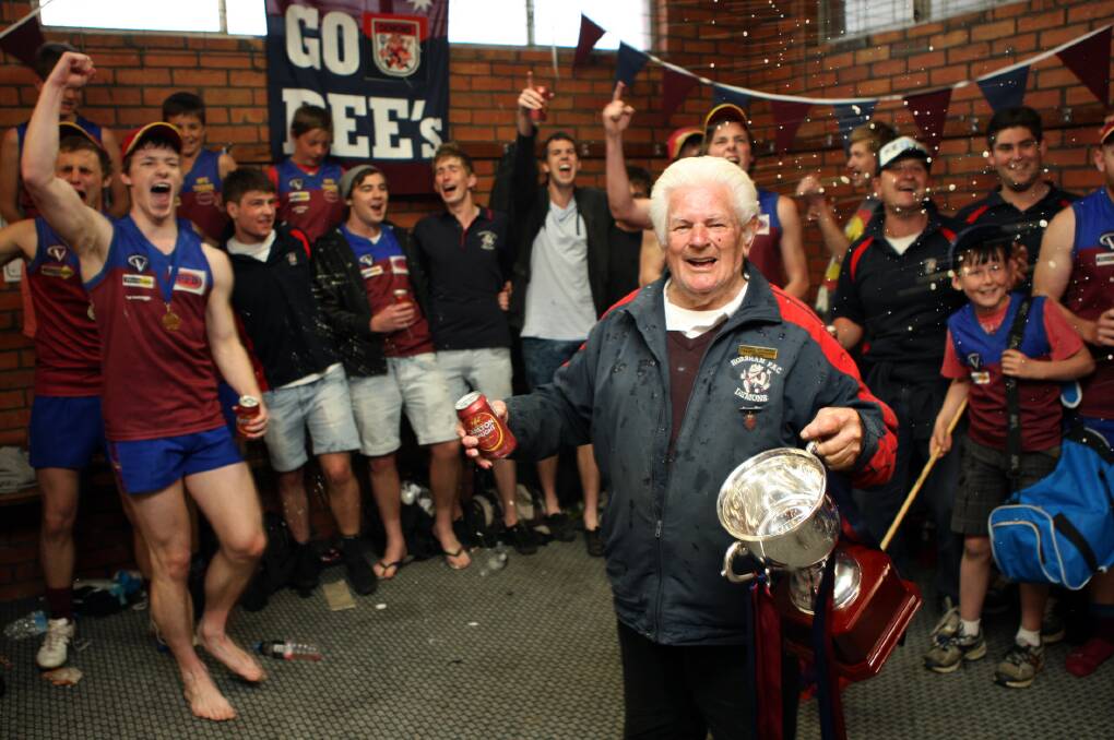 REMARKABLE RUN: Horsham trainer Hugh Avery, pictured celebrating the Demons’ 2012 Wimmera league premiership, has called time after more than 50 years as a trainer with the club. Picture: PAUL CARRACHER
