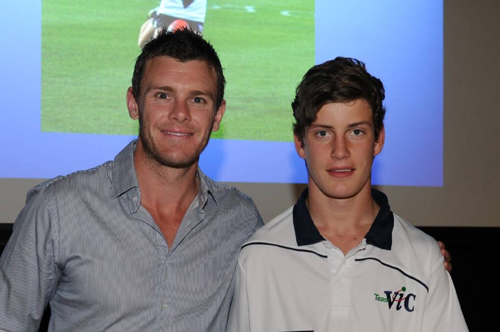 Geelong premiership star Cam Mooney with Horsham Saints' Jarrod Berry. Berry and Sam White will represent Vic Country at the NAB AFL Under-16 Championships next month.