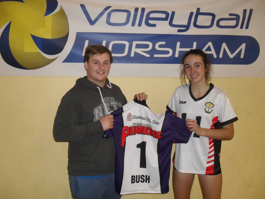 READY TO GO: Athletics star Anna Bush, pictured receiving her top from Western Phantoms division two women’s coach Matthew Berry, will make her debut on Saturday.