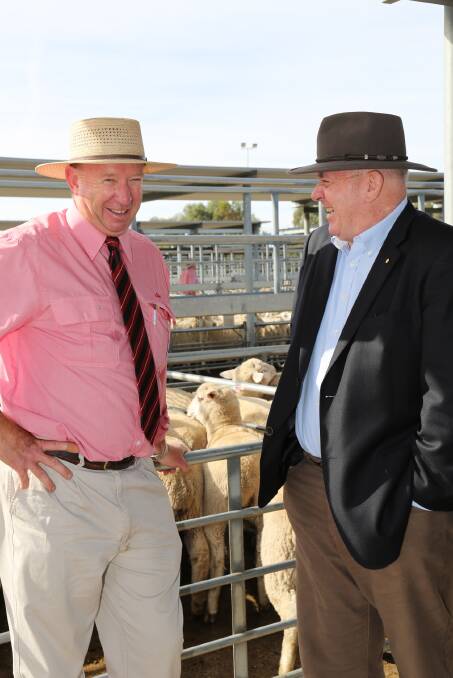 Andrew Adamson speaks to Governor-General Peter Cosgrove at the Horsham Regional Livestock Exchange. Picture: THEA PETRASS