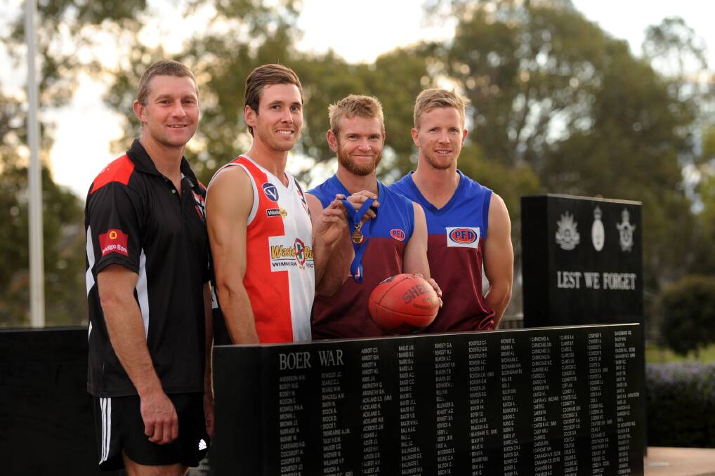IN HIS HONOUR: Horsham Saints Shayne Breuer and Xander McRae with Horsham Demons Nick Pekin and Brad Hartigan. The two sides will face off in the weekend's Anzac Day clash. For the first time in the game's history, a medal struck in honour of Horsham First World War soldier Sergeant Bertram Perry will be presented to the best player on the ground. Picture: SAMANTHA CAMARRI