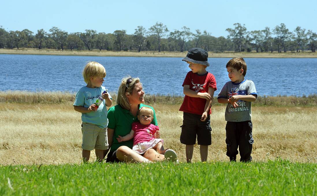 FAMILY HOPES: Sara McDonnell with her children William, Eliza and Tom at Lake Wallace in 2010. Family friend Clancy Shirrefs is also pictured, far right, enjoying the lake at Edenhope. Picture: PAUL CARRACHER