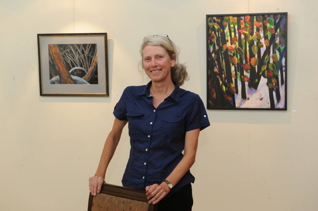 Christine Bever with some of the pieces in her new exhibition at Horsham’s Redrock Books and Gallery. Picture: PAUL CARRACHER