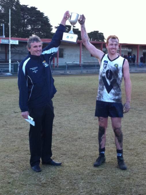 VICTORIOUS: Horsham coach and Vic Country 2 captain Jordyn Burke, right, celebrates the 80-point win against the Victorian Amateur Football Association with coach John Cossar at Geelong’s St Albans Reserve. It was Burke’s third success with the side after victories in 2011 and 2013.