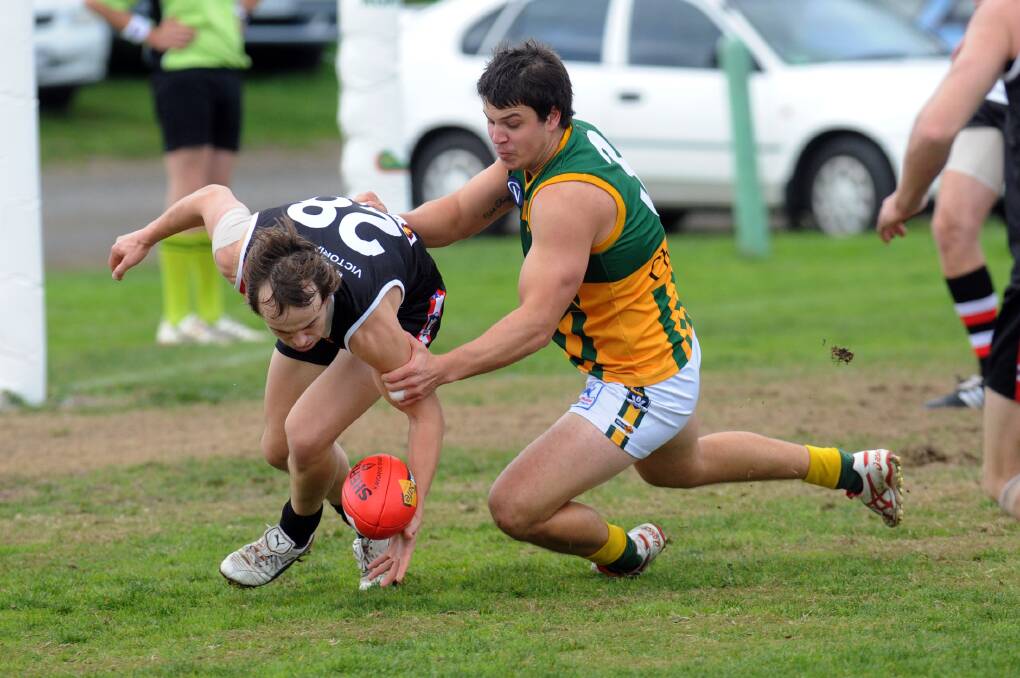 TOUGH ENCOUNTER: Horsham Saints on-baller Sam Clyne and Dimboola forward Lachie Exell will be important players when their sides clash on Saturday. Picture: PAUL CARRACHER