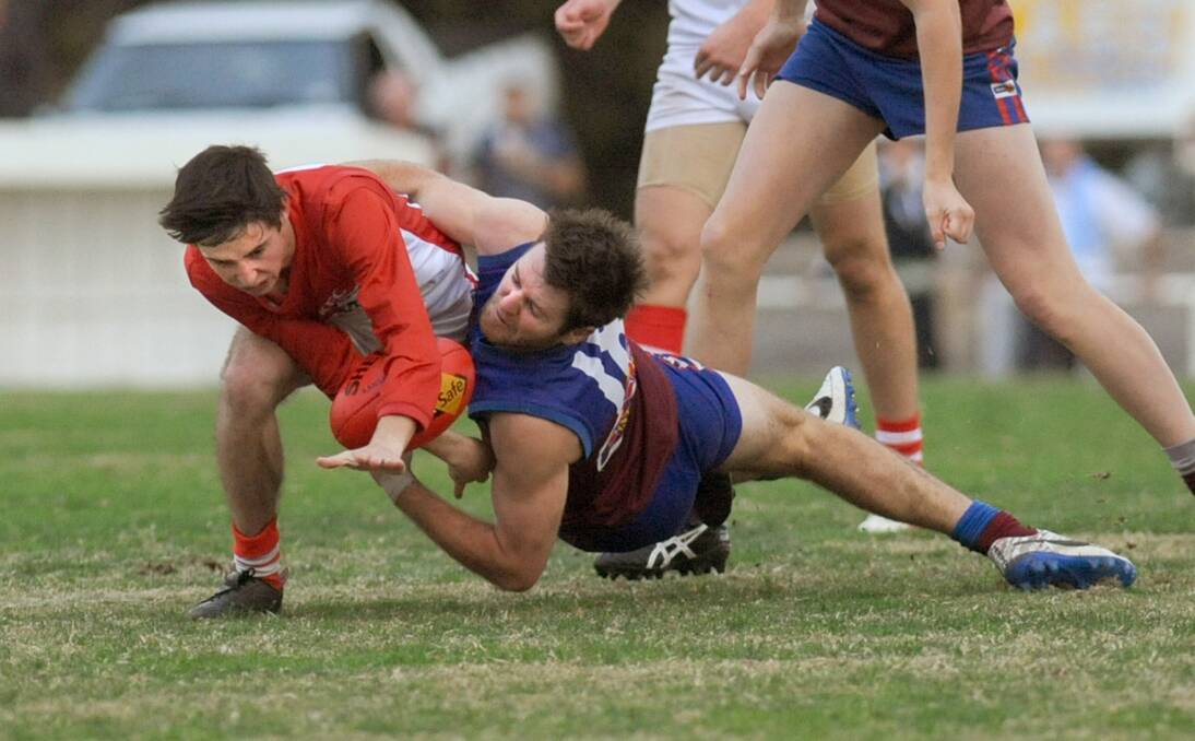 Tyler Cronin, pictured against Horsham's Simon Hobbs earlier this year, was one of four multiple goal-kickers for the Rats. Ararat will play finals footy for the first time since 2010 after beating Stawell at the weekend. Picture: SAMANTHA CAMARRI