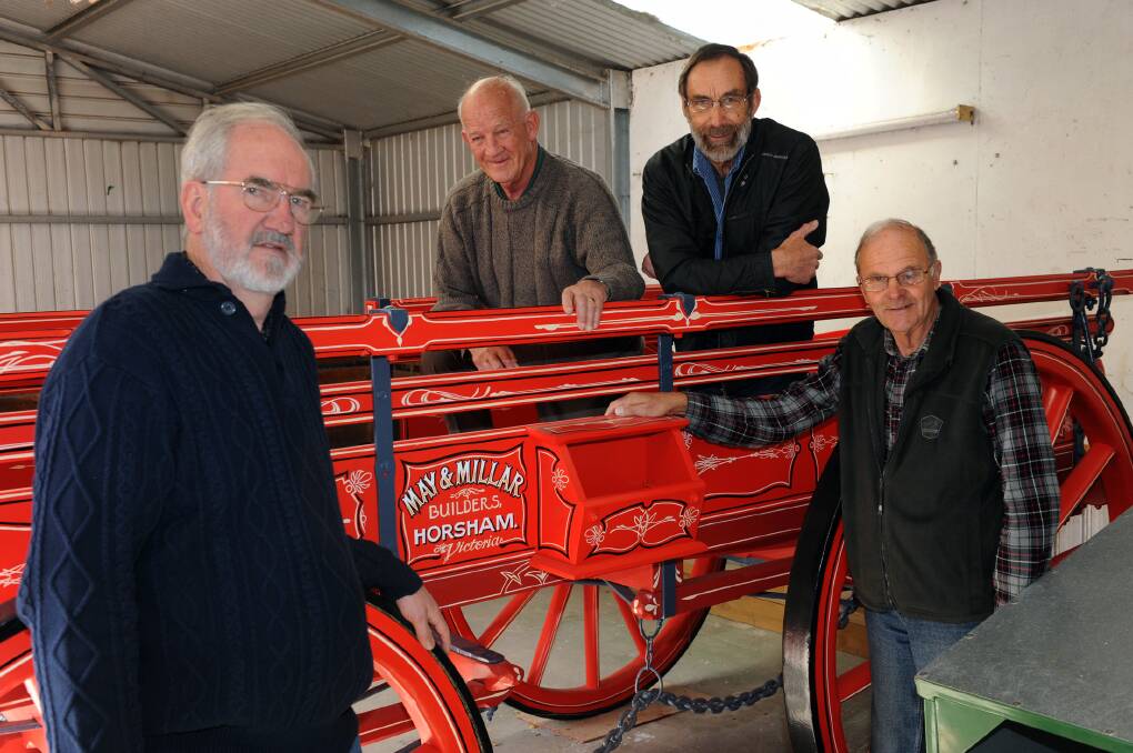 Rod Jenkinson, Don Johns, Don Mitchell and Chas McDonald with a restored May and Millar wagon. The restoration of the early 20th century wagon is a finalist in the Tidy Towns cultural heritage category. Picture: PAUL CARRACHER