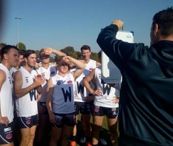 PLAN: The Wimmera teams listens to instructions during a break at Moama Recreation Reserve on Saturday. Picture: CONTRIBUTED