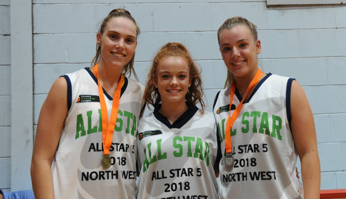 STARS: Bendigo's Madeline Sexton, Swan Hill's Laura Anderson and Horsham's Georgia Hiscock show off their all star singlets. Picture: STUART McGUCKIN