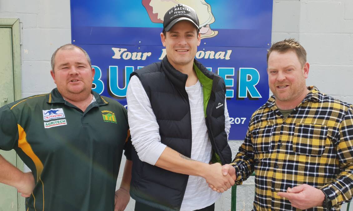 SHAKE: Dimboola football director Mick Henderson and club president Col Campbell congratulate Justin Beugelaar, centre. Picture: CONTRIBUTED