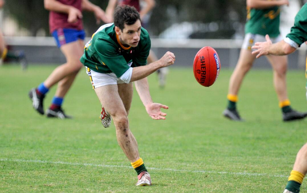 BACK IN ACTION: Oliver Braithwaite dishes off a handball for Dimboola during the 2017 Wimmera Football League season. Picture: SAMANTHA CAMARRI
