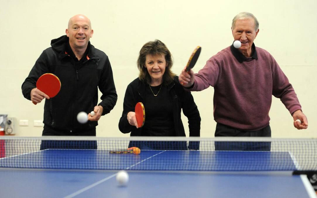 YOU'RE SERVED: Leon Forrest, Kerry Hepburn and Gino Roiter practice their serves at the new Horsham Table Tennis Centre. Picture: STUART McGUCKIN