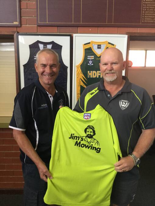 Howard Schier and Kingsley Dalgleish holding the umpire shirt that will be worn in the Wimmera Football League and Horsham District Football Netball League. Picture: CONTRIBUTED