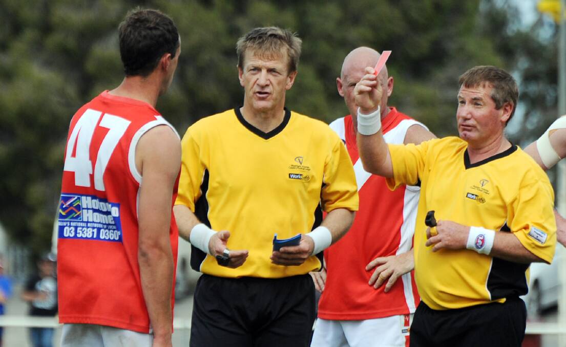 Frank Marklew issues a red card during the 2011 Horsham District Football League reserves grand final.