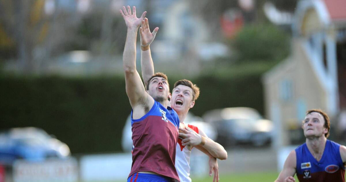 BIG MAN: Horsham's Billy Carberry holds onto front position to contest a boundary throw in during the third quarter before being taken from the ground in the fourth. Picture: STUART McGUCKIN