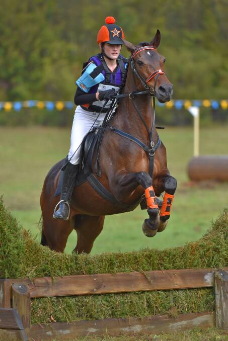 UP: Morgan Lane clears the barrier during the Pony Club Victoria Horseland Interzones Horse Trials Championships at Gladysdale earlier in May. Picture: DEREK O’LEARY
