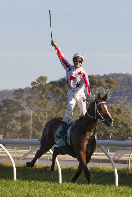 Jack Hill rises in triumph as he crosses the line to win the Stawell Gold Cup.