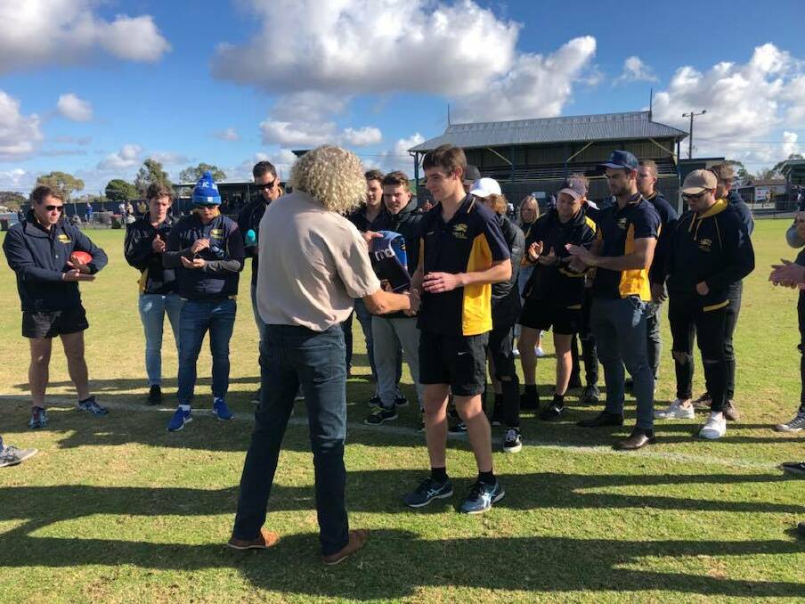 EXCITEMENT: Nhill Tigers legend Steve Graham presents Josh Lees his jumper before his first senior game for the club. Picture: CONTRIBUTED
