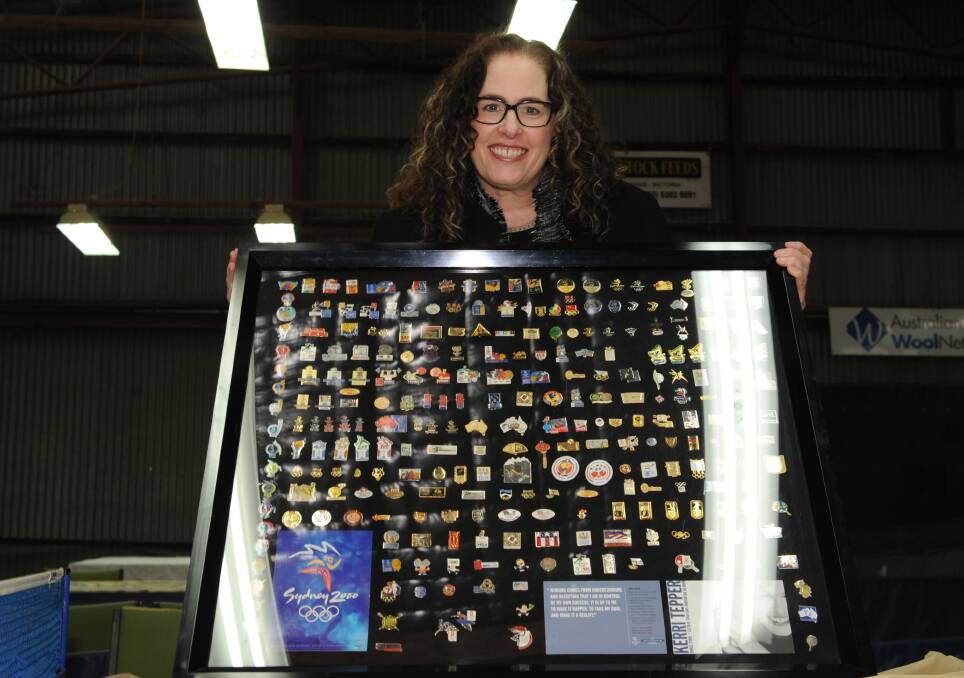 STAR: Murtoa-born table tennis star Kerri Tepper with a board of pins she donated to the Horsham Table Tennis Association at the weekend. Picture: STUART McGUCKIN