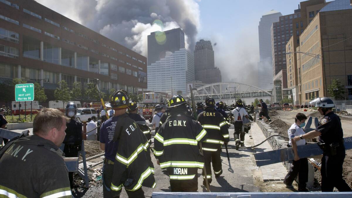 New York City firefighters stream towards Ground Zero after the collapse of the World Trade Center's twin towers on September 11, 2001. Picture: Getty Images