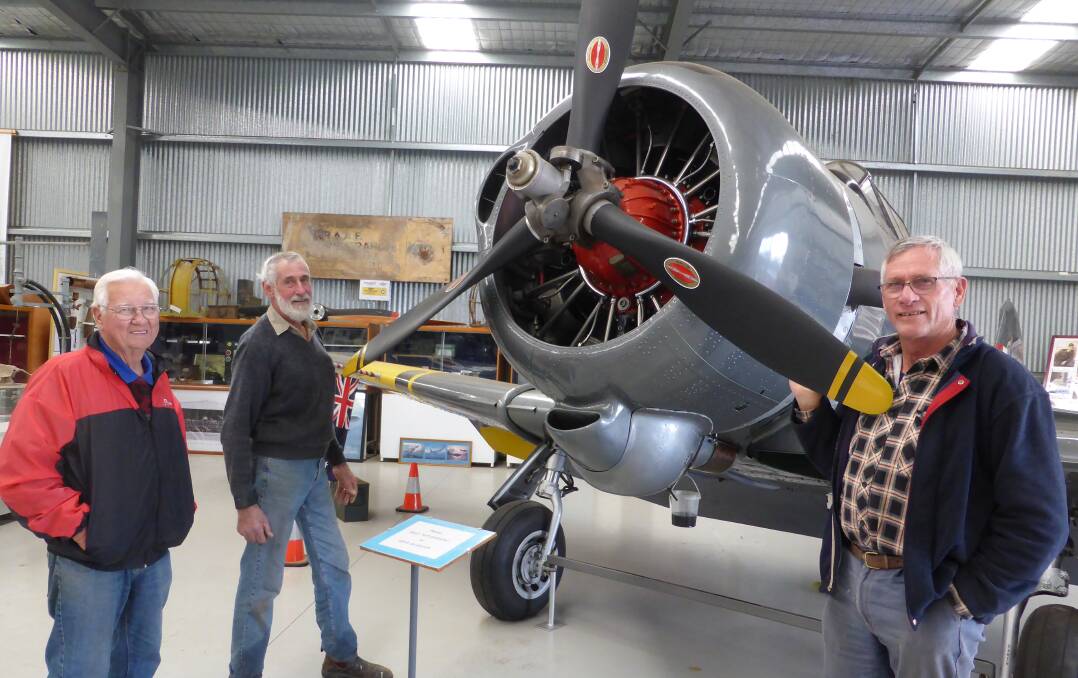 NAHC Board members John Deckert, Len Creek and Trevor Borgelt. They are pictured with a Wirraway the people of Nhill bought for $300,000. Picture; CONTRIBUTED