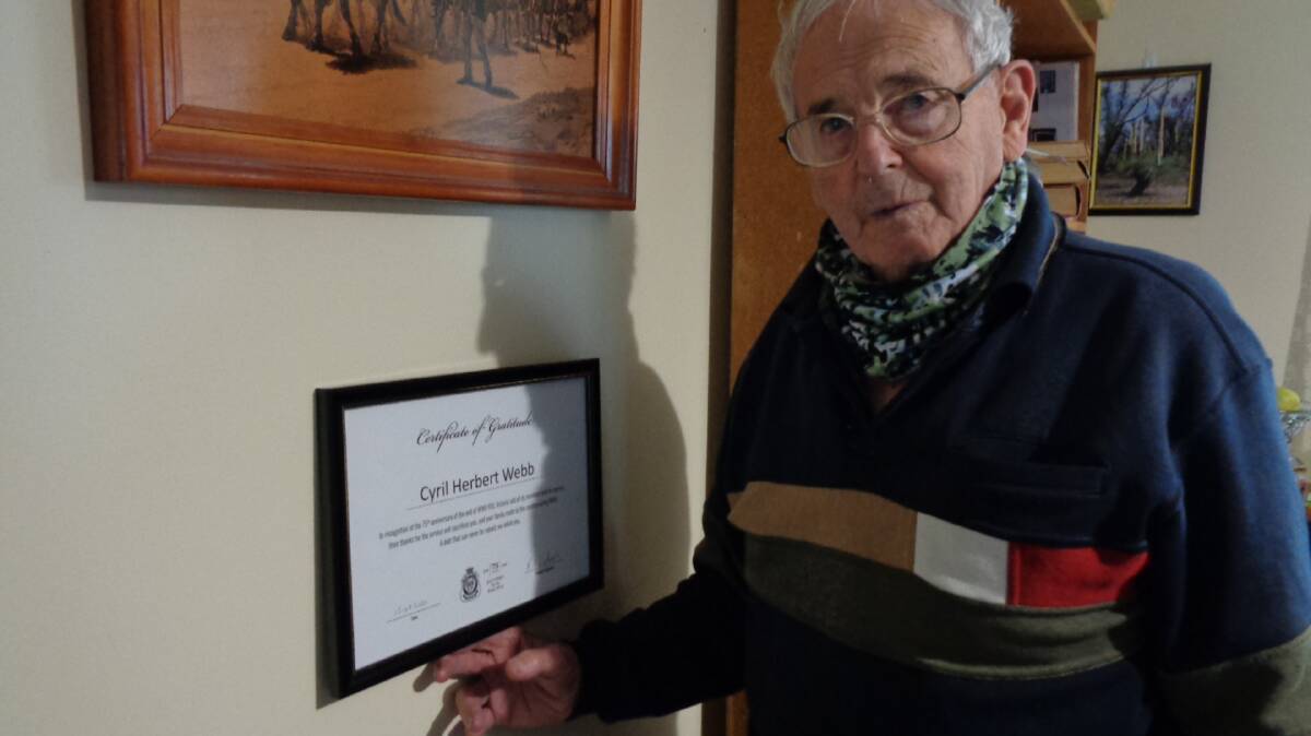 War veteran: Cyril Webb and his award from Horsham RSL. Picture: CONTRIBUTED 