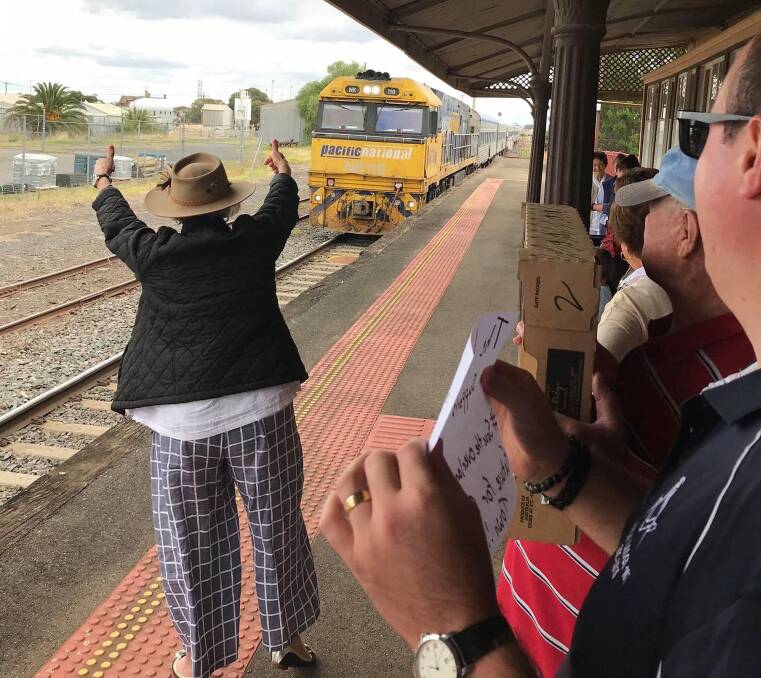 ALL ABOARD: Campaigners greet the Overland at Nhill station. Picture: MARGARET MILLINGTON