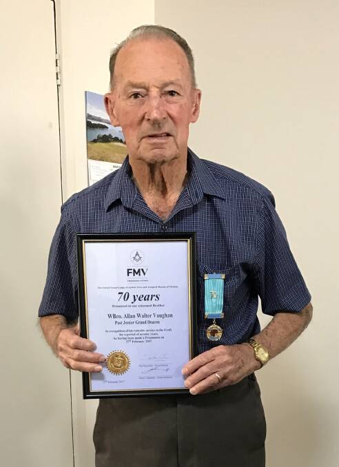 MILESTONE: WBro Allan Vaughan PJGD proudly wears his 70 Year Jewel and displays his certificate.