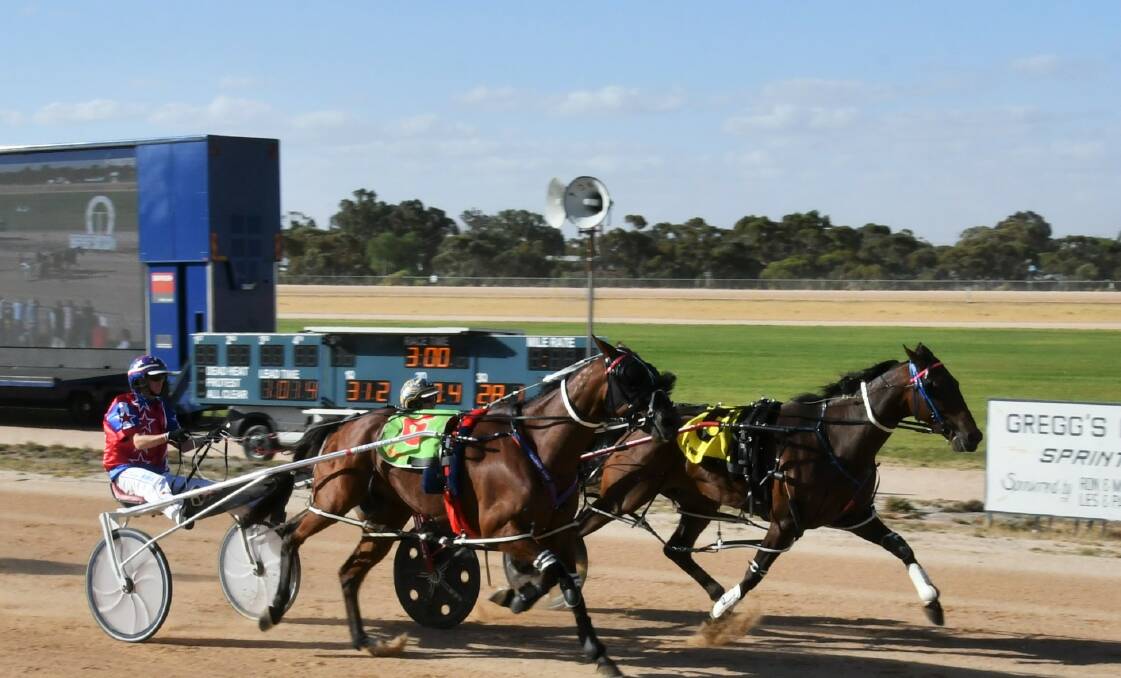 FAST FINISH: Ouyen Pacing Cup came down to the wire between eventual winner Perspective (inside runner) driven by Mark Pitt and Motu Meteor with trainer/driver Kerryn Manning. Picture: Clare Weston