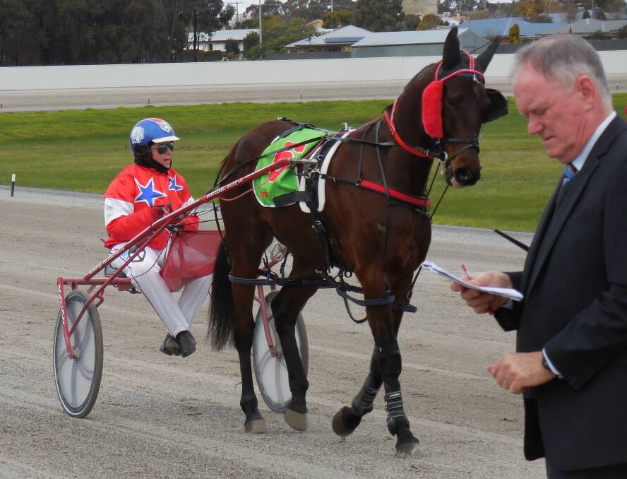 ON A ROLL: Ararat driver Denbeigh Wade and five-year-old gelding Dontshowyouraces parade in front of Harness Racing Victoria steward Barry Delaney after a recent victory at Stawell. 