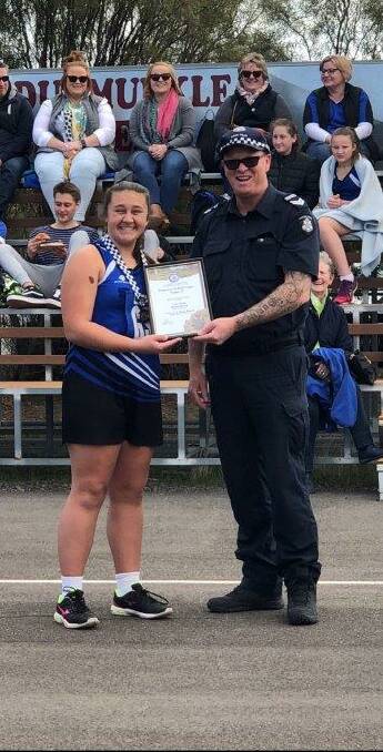 CONGRATULATIONS: Lori Young receives her award from Minyip police officer Leading Senior Constable Michael Baldock.