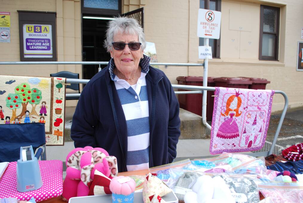 CRAFTY: Delys Jolly with craftwork produced by U3A groups. U3A celebrated its 30 birthday with a market day.