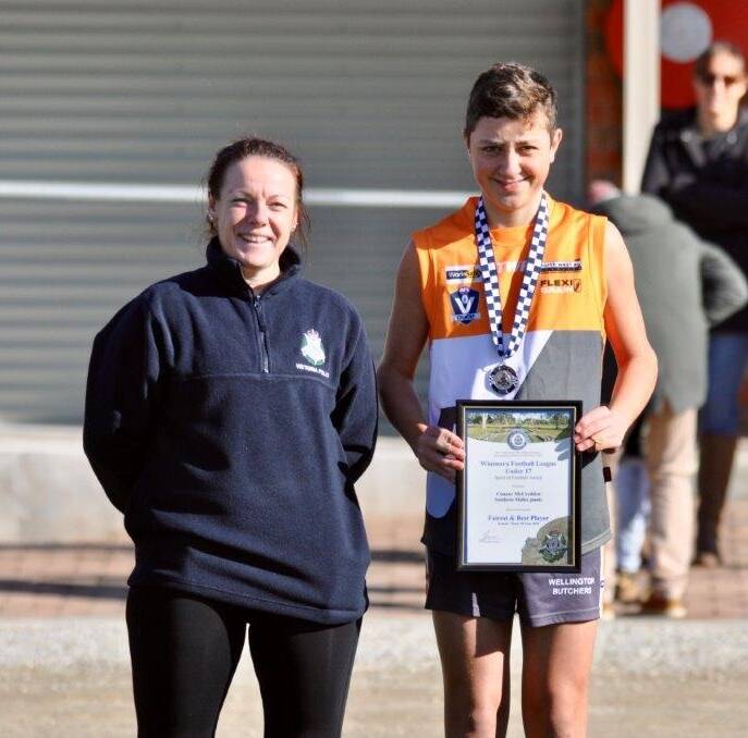 WELL DONE: Connor McCredden receives his Spirit of Football Award from Hopetoun  police officer Senior Constable Anna Lake before his game on Saturday.