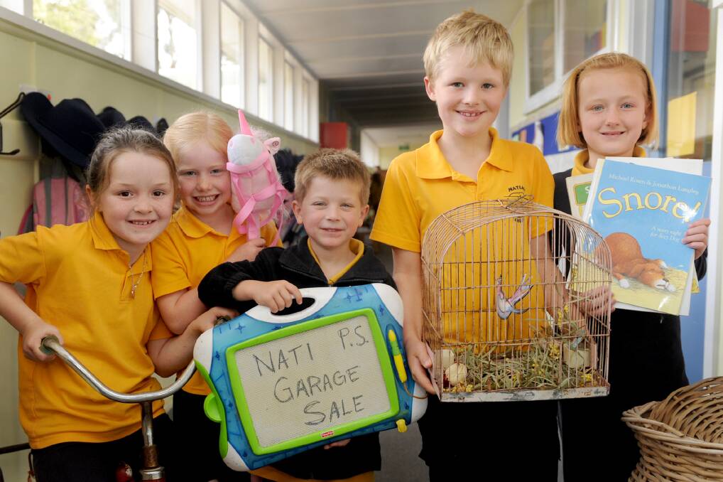 SALE TIME: Natimuk Primary School students Ebony Klowss, grade one, Olivia Sudholz, prep, Cody Maybery, prep, Toby Wilkins, grade two and Patria Lees, grade two, prepare for the Very Nati Garage Sale on November 4. Picture: SAMANTHA CAMARRI
