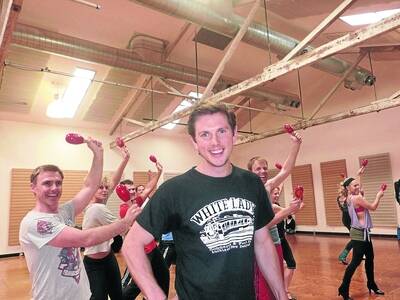 READY TO ROCK: Alex Rathgeber, front, rehearses with cast members from The Boy from Oz. Picture: RACHEL TAYLOR