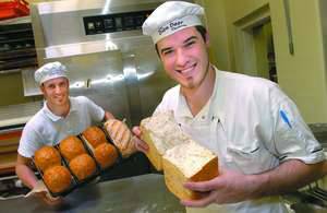 GOOD BREAD: Oven Door Bakery baker Kane McCallum, left, and bakery manager James Henwood with some of their award-winning multigrain bread. The pair won a major award for their bread at the National B
