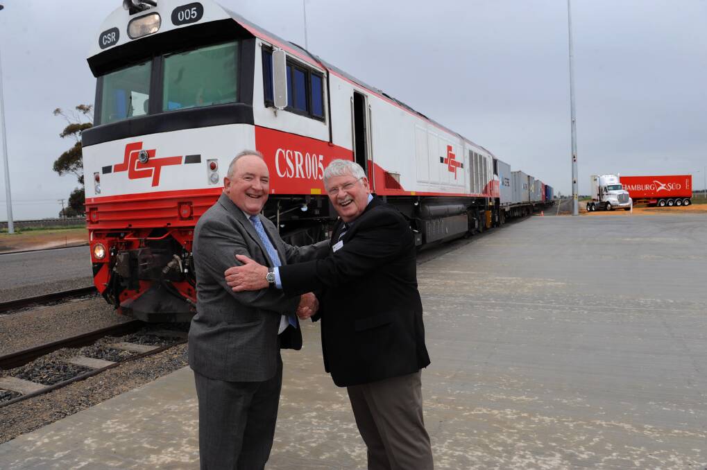 Wimmera Intermodal Freight Terminal project manager Kevin McGlinn and former Horsham Rural City Council technical services manager David Eltringham celebrate the opening of the terminal. Picture: PAUL CARRACHER