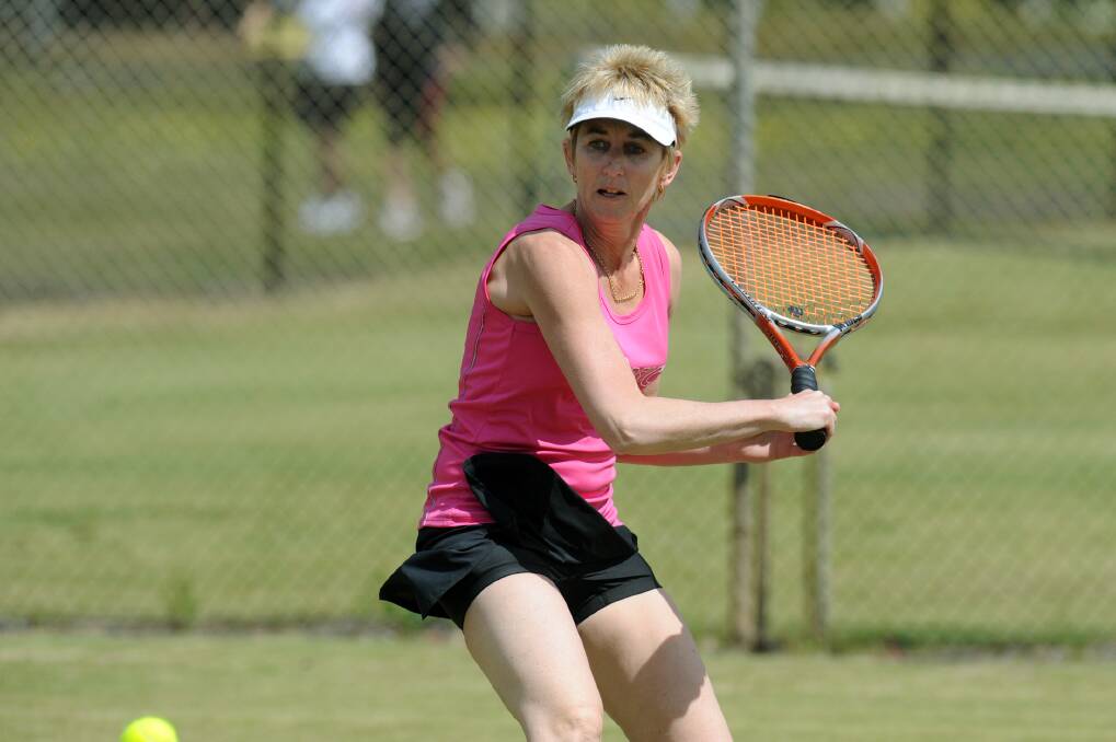 Wendy Lloyd of Horsham Lawn Bardell lines up a slice during a match against St Michaels.