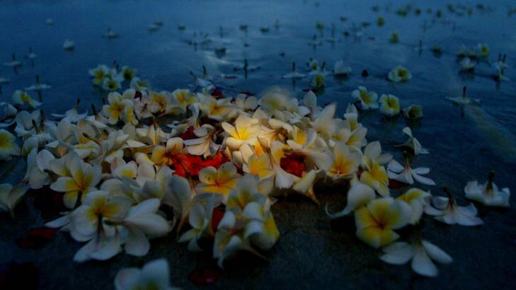 Not forgotten ... a floral tribute on Kuta Beach, Bali.