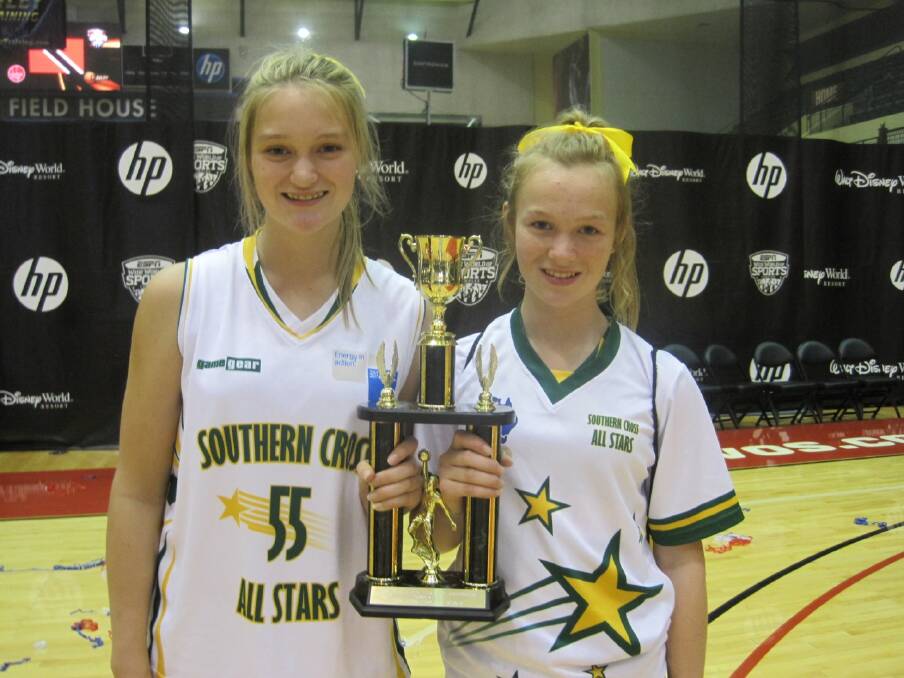 Mikayla McAuliffe and Aily McAuliffe celebrate a third place finish at the International Global Cup basketball tournament in the United States of America. Picture: CONTRIBUTED