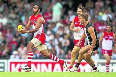 HORSHAM DUO: St Kilda draftee Sebastian Ross chases Sydney Swans co-captain Adam Goodes at Etihad Stadium on Friday night. The pair both played for Horsham Demons before they were drafted. Pictures: GETTY IMAGES