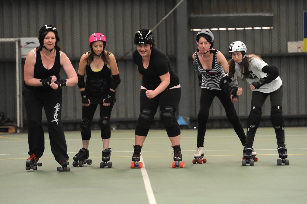 Derby Dolls show how it is done at a practice session at Horsham Lanes and Games. Picture: PAUL CARRACHER