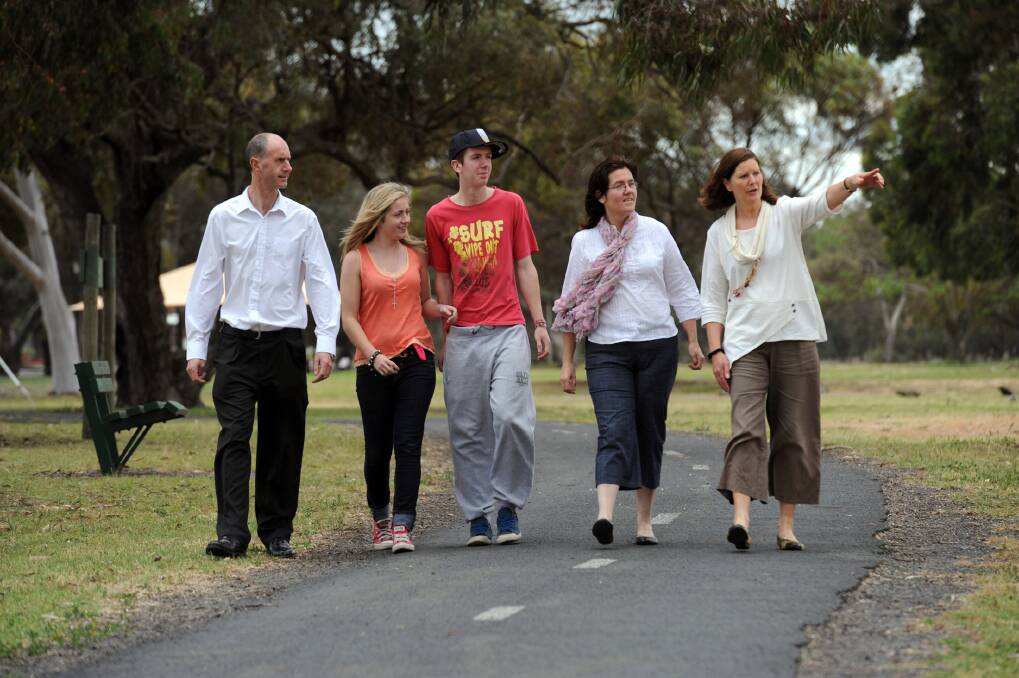 WELCOME TO HORSHAM: Wimmera Development Association migrant project worker Janet Heard, right, shows Mark Stringer, Shauna Stringer, 14, Carl Stringer, 16 and Pauline Mann-Stringer the sights of their new home. Picture: PAUL CARRACHER