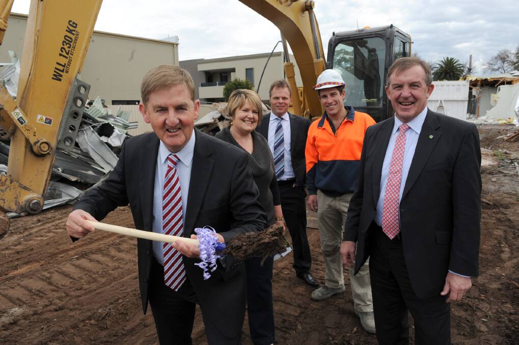 Deputy Premier Peter Ryan turns the first sod of the Wimmera community centre, He is pictured with Wimmera Uniting Care chairwoman Pam Clarke, Member for Western Victoria David O'Brien, Luke Uebergang of Horsham Excavations and Member for Lowan Hugh Delahunty. Picture: PAUL CARRACHER